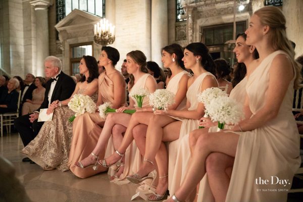 Bridesmaids seated during a wedding ceremony at The New York Public Library planned by Leslie Price of In Any Event NY. 